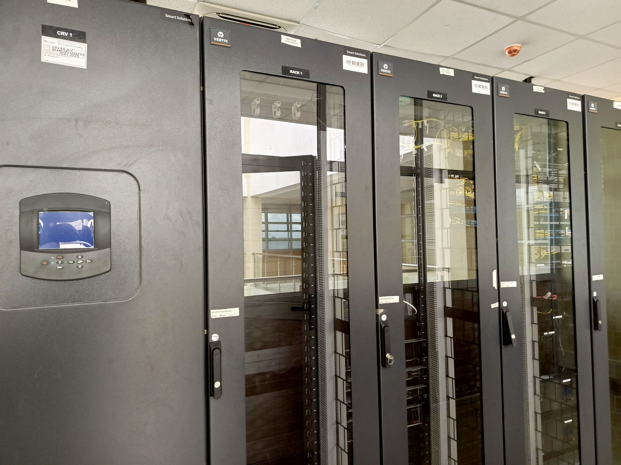 Network cabinet with structured Cat6 cabling and patch panels installed in a server room